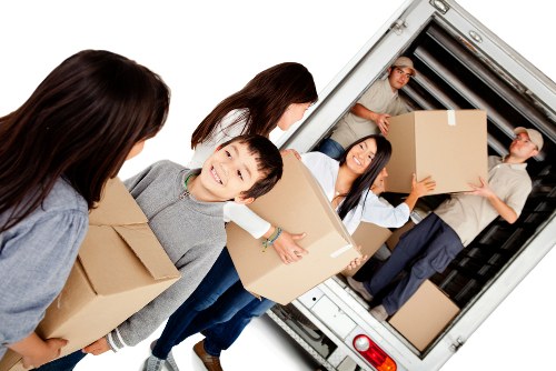 Office relocation planning in Seven Sisters with business equipment and moving boxes