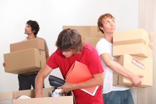 Local removals team loading household furniture for a Seven Sisters move