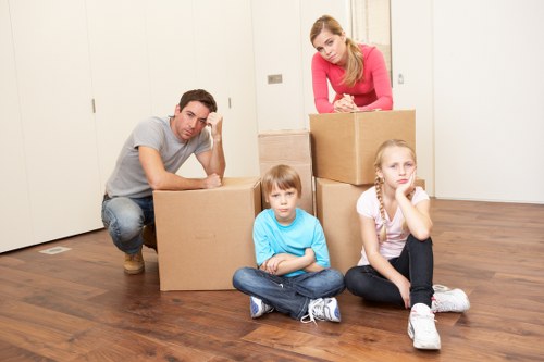 Furniture and boxes being moved from a flat in Seven Sisters