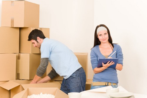 Packed boxes and furniture ready for transport in Seven Sisters