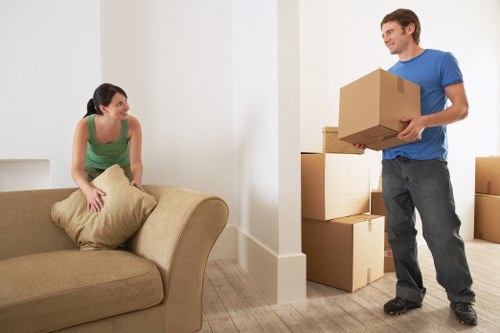 Loading furniture into a removals van on a North London street